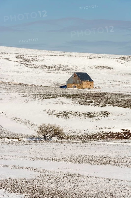Farm in winter in Cezallier massif