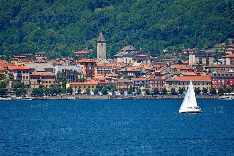 Sailboat in front of the old town of Cannobio