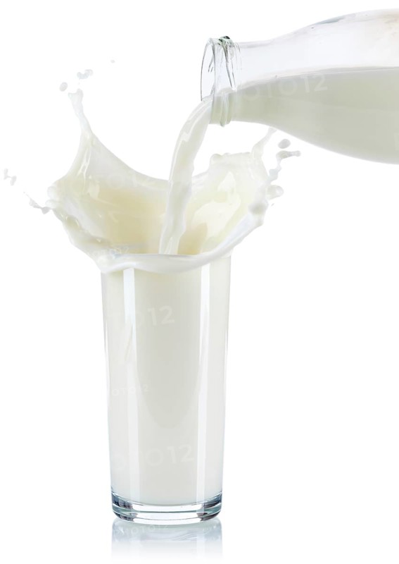 Milk splash squirt splash pour pour glass cropped cropped isolated against a white background