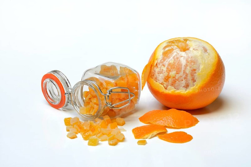 Candied orange peel cubes in glass