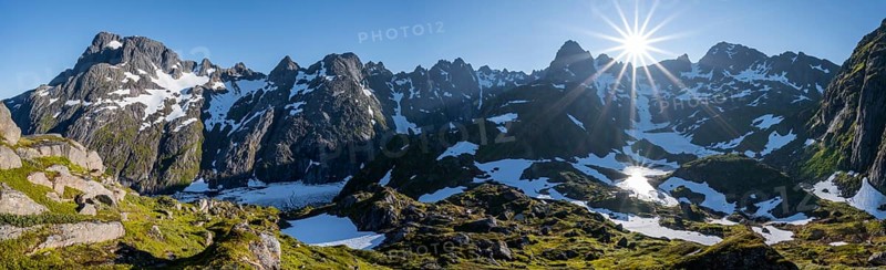 Sun shining on mountains with snow