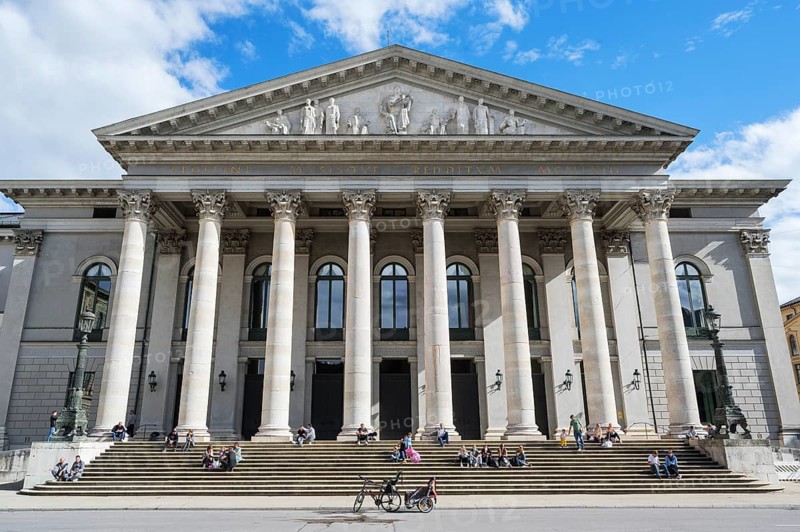 People sunbathing in front of the opera