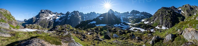 Sun shining on mountain panorama