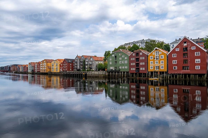 Colourful historic warehouses by the river Nidelva