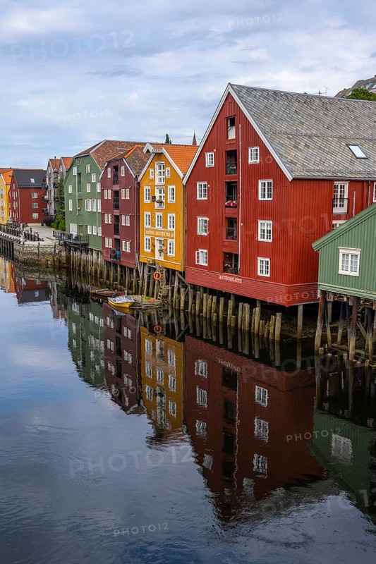 Colourful historic warehouses by the river Nidelva