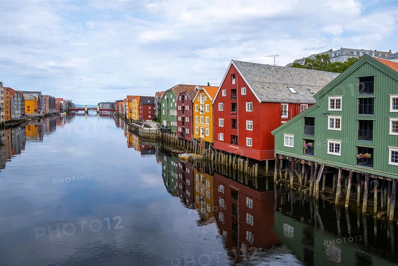 Colourful historic warehouses by the river Nidelva