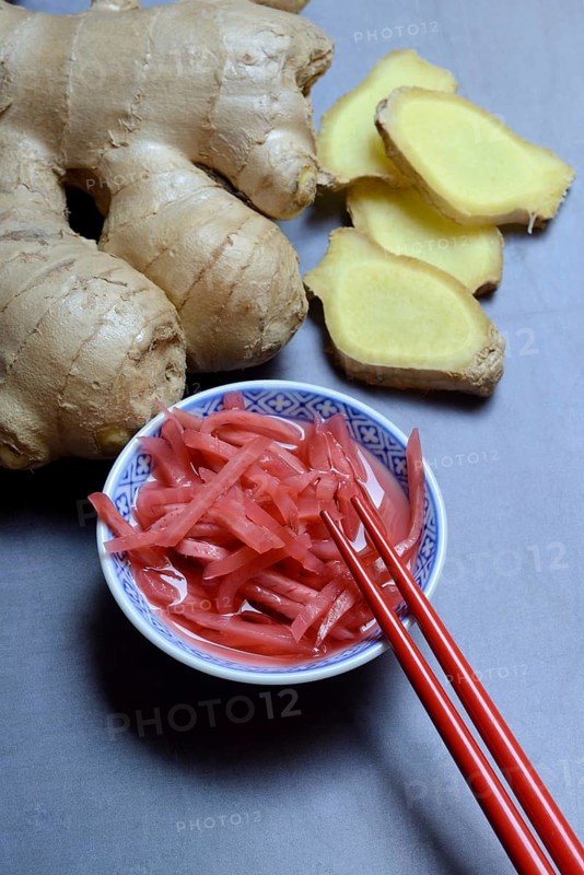 Pickled ginger in small bowls and ginger slices