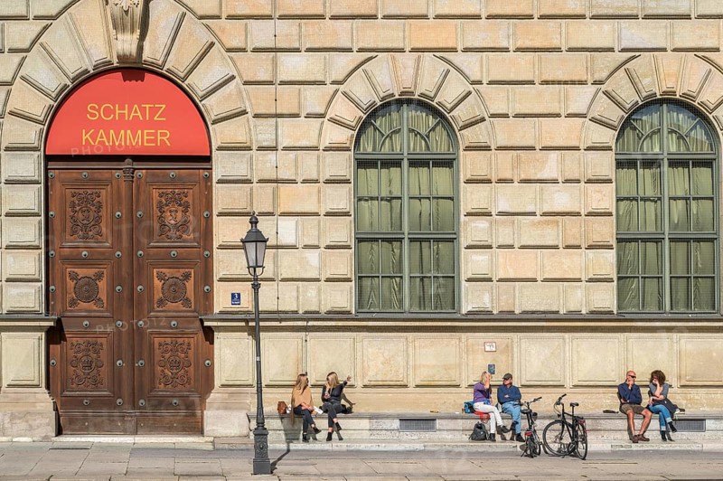 People sunbathing in front of the Residenz