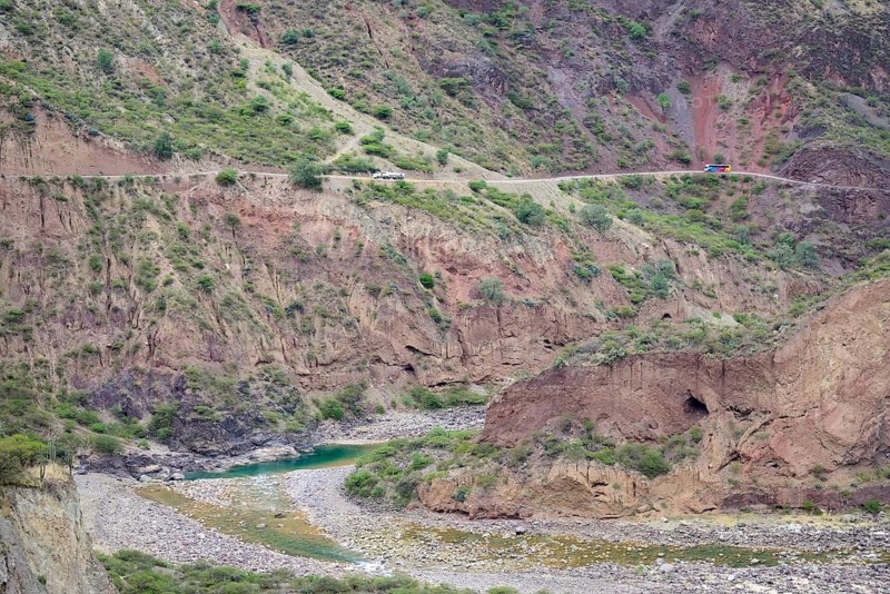 Coach and truck above the gorge of the Rio Mantaro