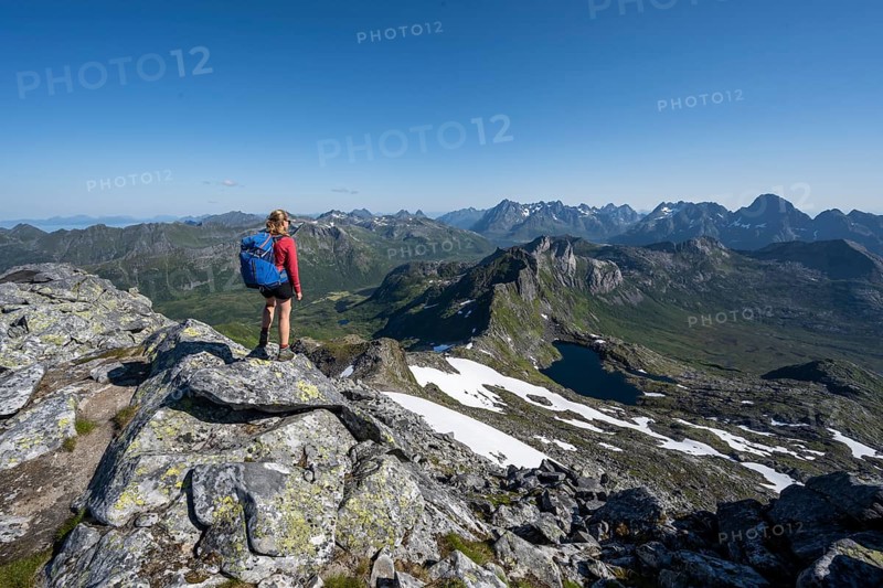 Hiker on the trail to the mountain Rundfjellet