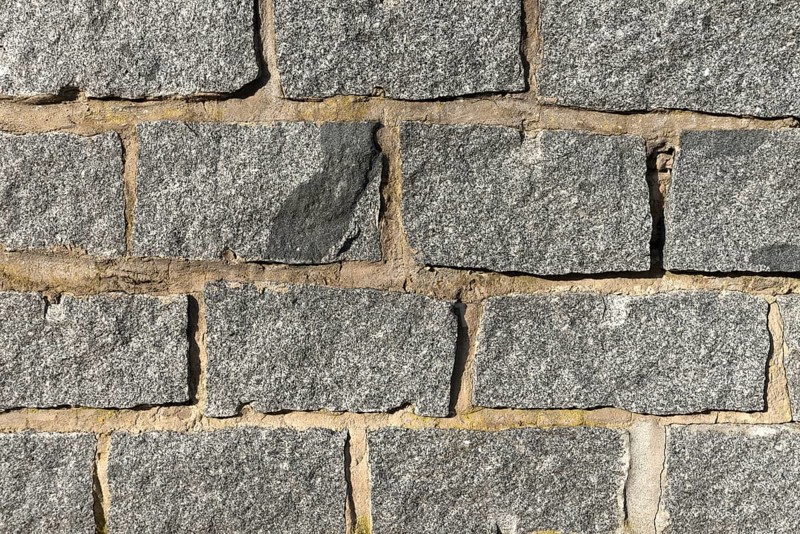 Wall of granite stones