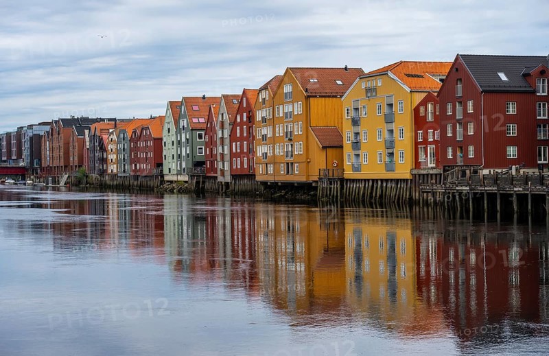 Colourful historic warehouses by the river Nidelva