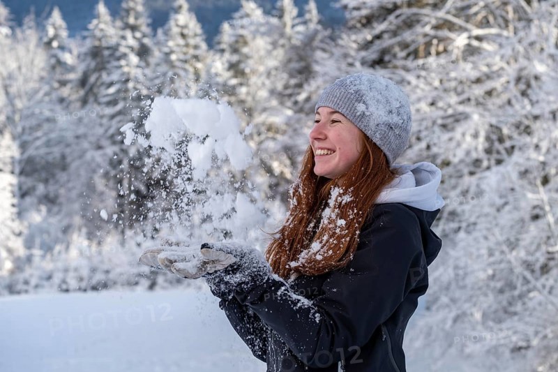 Woman enjoying the snow during winter walk