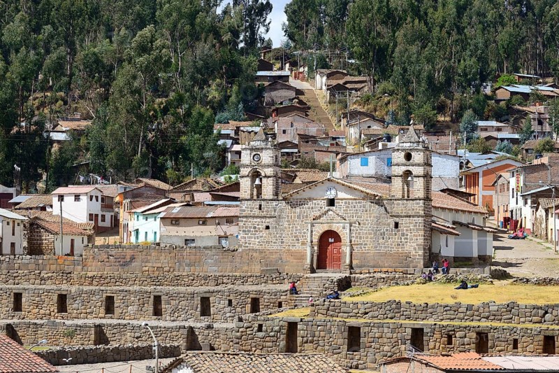 Inca sun temple with colonial cathedral on top in the middle of the village