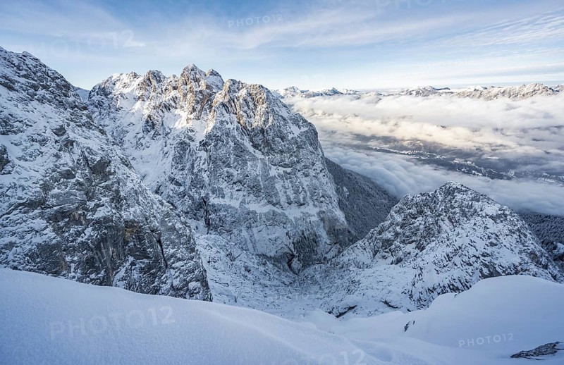 View of snowy Waxenstein and cloudy valley