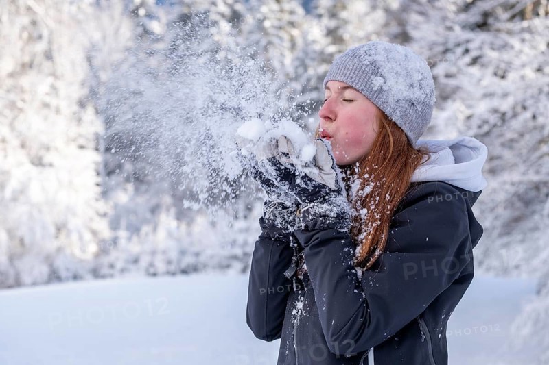 Woman enjoying the snow during winter walk