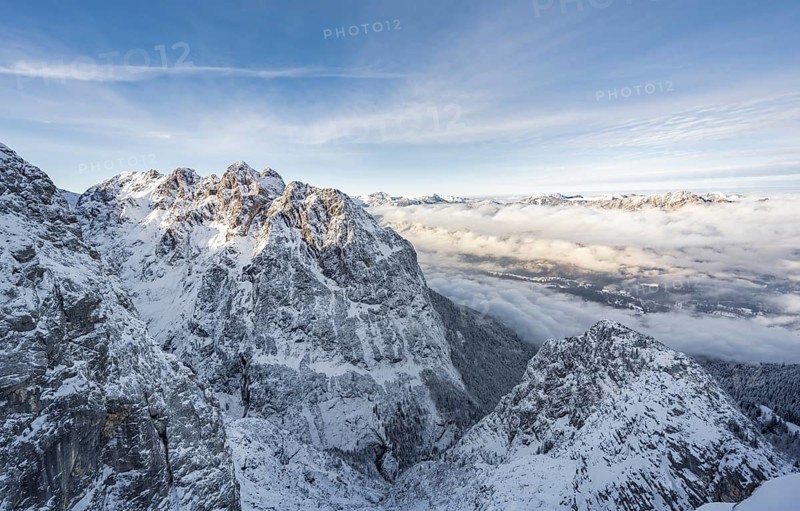 View of snowy Waxenstein and cloudy valley