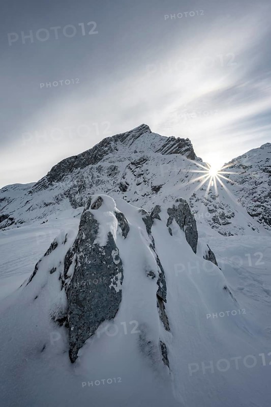 Snowy Alpspitze with sun star