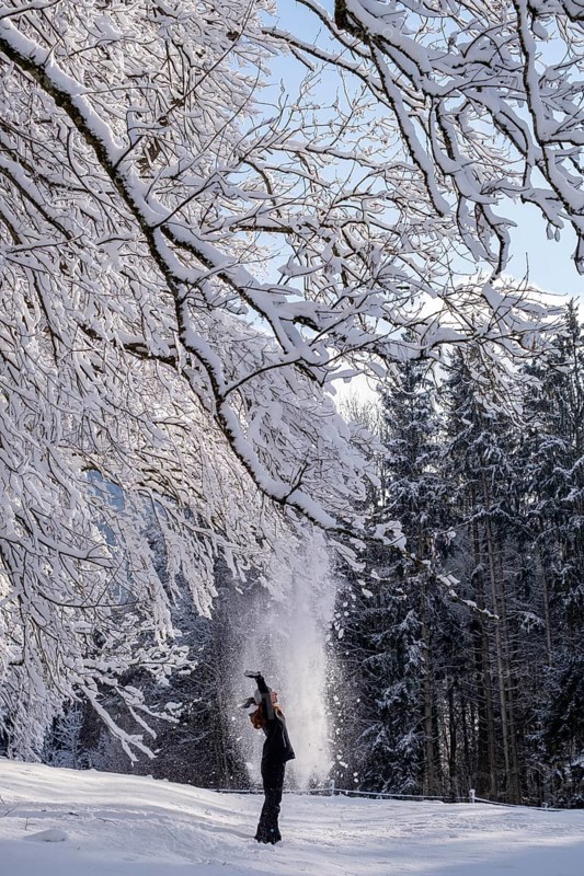 Woman enjoying the snow during winter walk