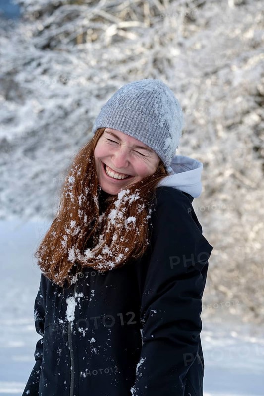 Woman enjoying the snow during winter walk