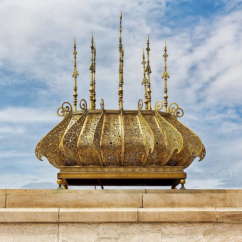 Ornate shiny metal lamp at the mausoleum of King Mohammed V