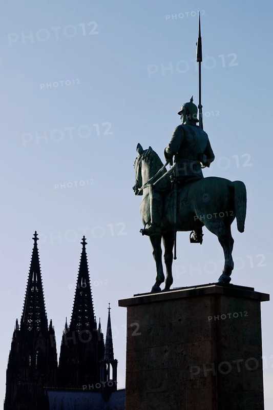 Monument of the 8th Prussian Cuirassier Regiment with the silhouette of the cathedral