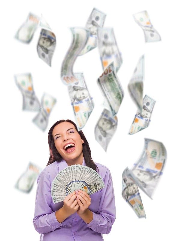 Celebrating young woman holding $100 bills with many others falling around her on white