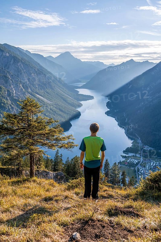 Hiker looks at Plansee
