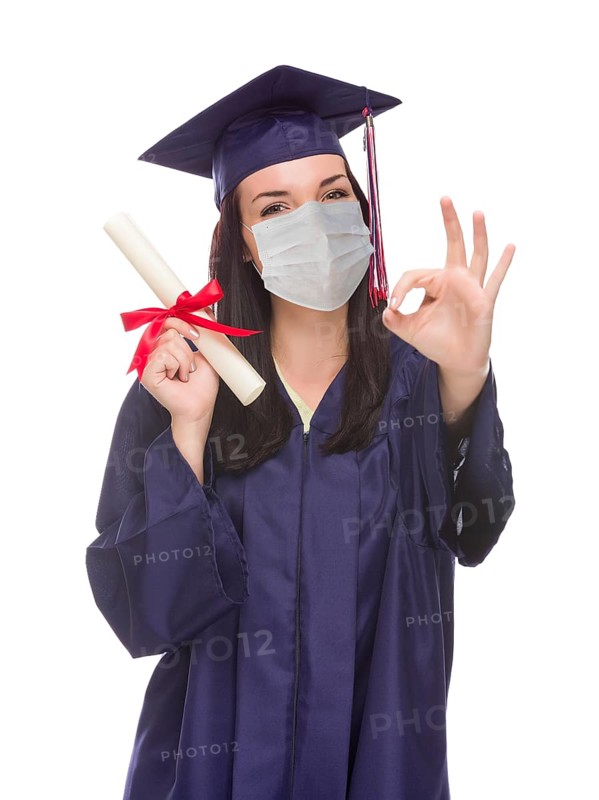 Graduating female wearing medical face mask and cap and gown isolated on a white background