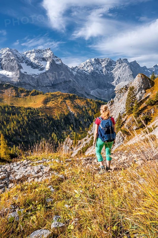 Hiker on hiking trail in the mountains