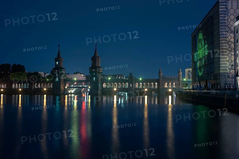 Oberbaum Bridge reflected in the water at night