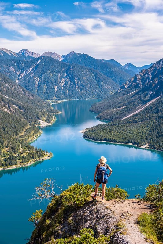 Hiker looking at Plansee