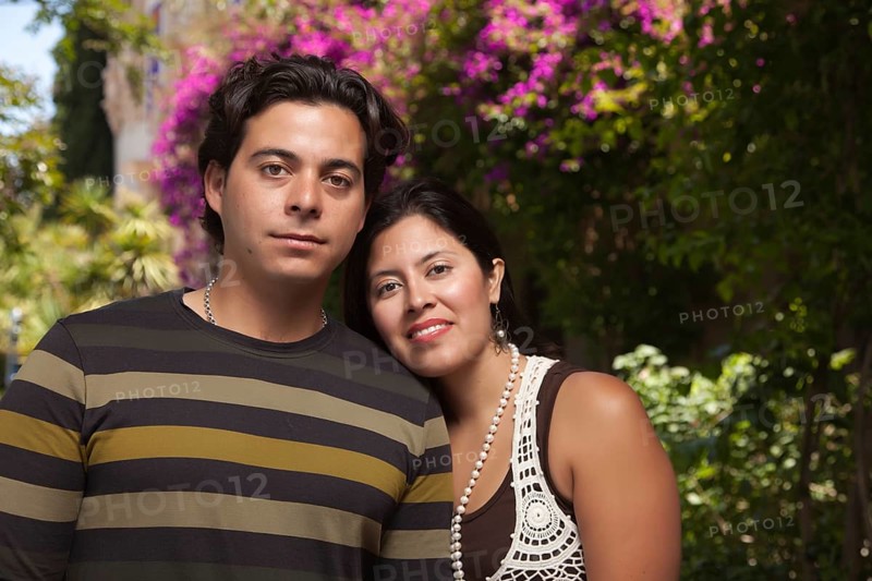 Happy attractive hispanic couple enjoying themselves at the park