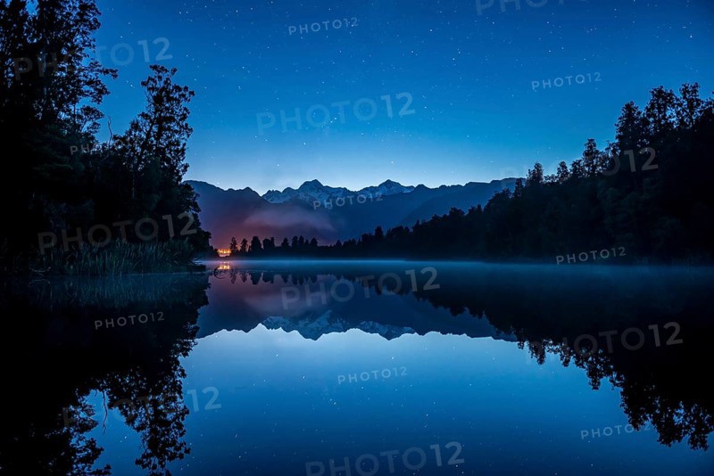 View of Mount Cook and Mount Tasman with starry sky