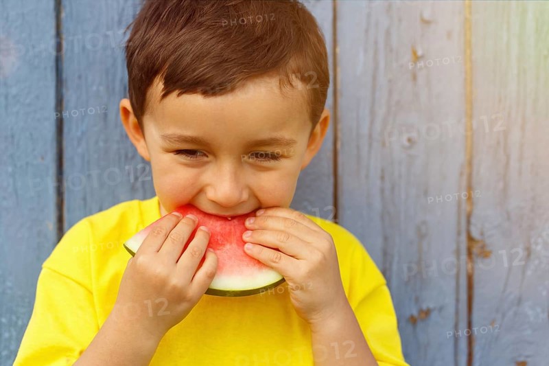 Summer watermelon child little boy eats