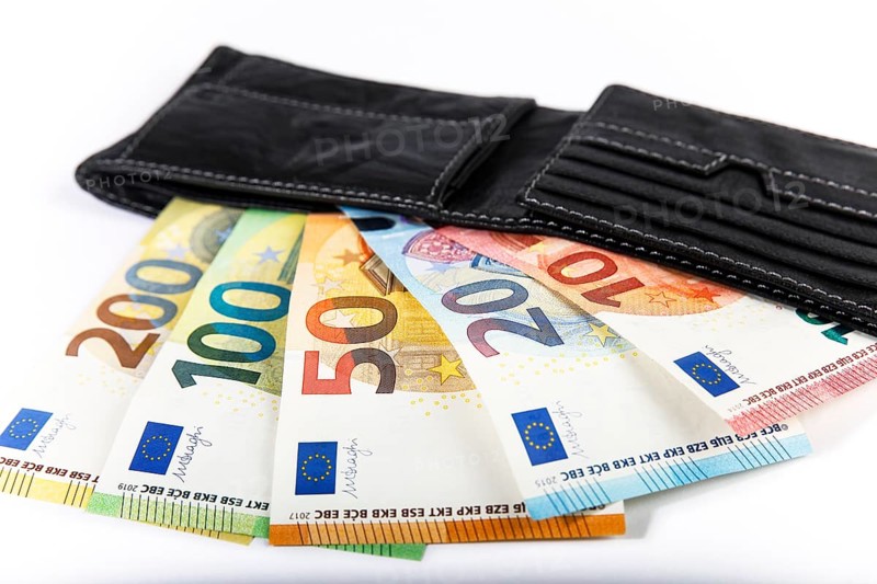Various euro banknotes in black leather wallet