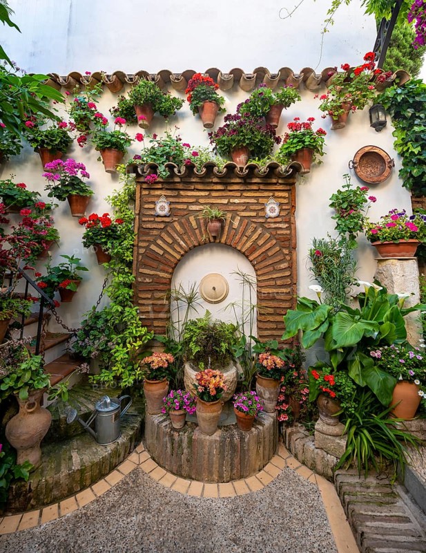 Fountain in the courtyard decorated with flowers