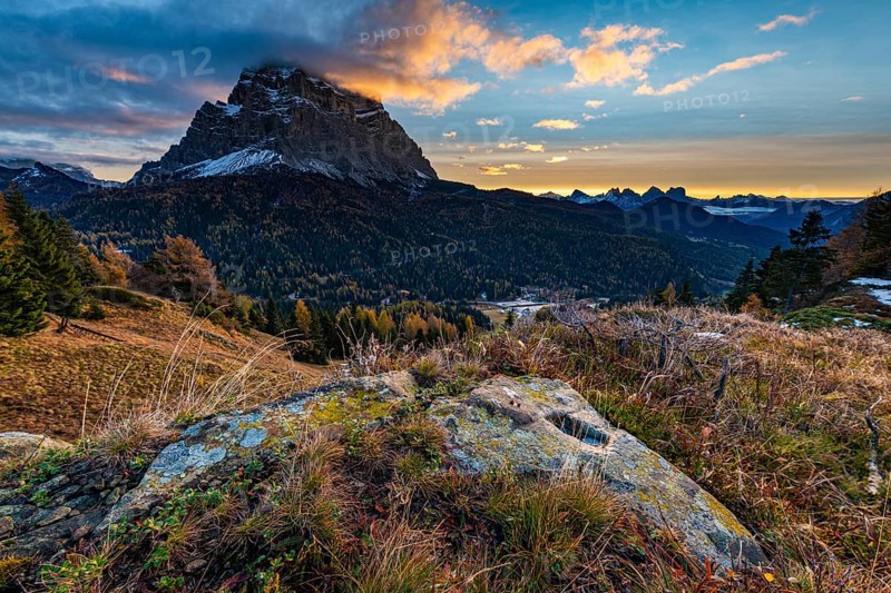 Peak of Monte Pelmo at sunrise with autumn landscape