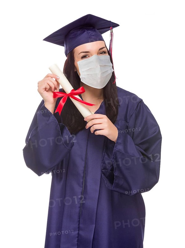 Graduating female wearing medical face mask and cap and gown isolated on a white background