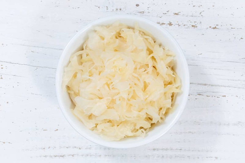 Sauerkraut white cabbage cabbage cut from top wooden board