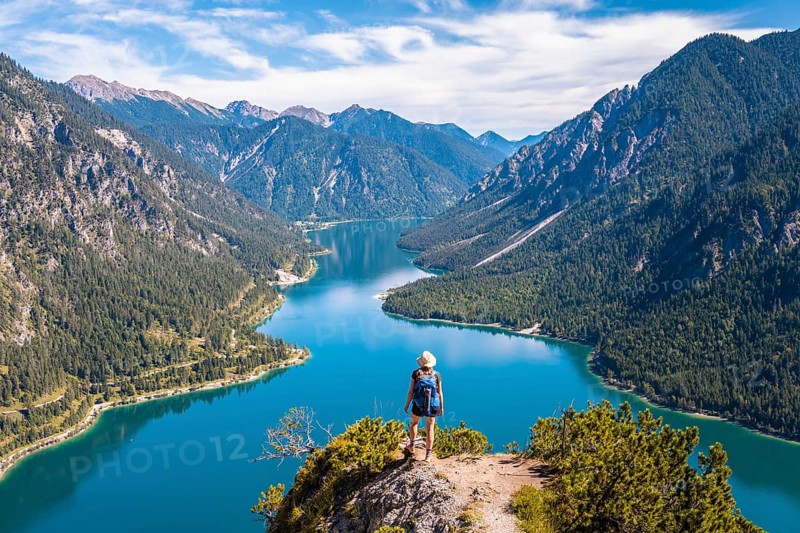 Hiker looking at Plansee