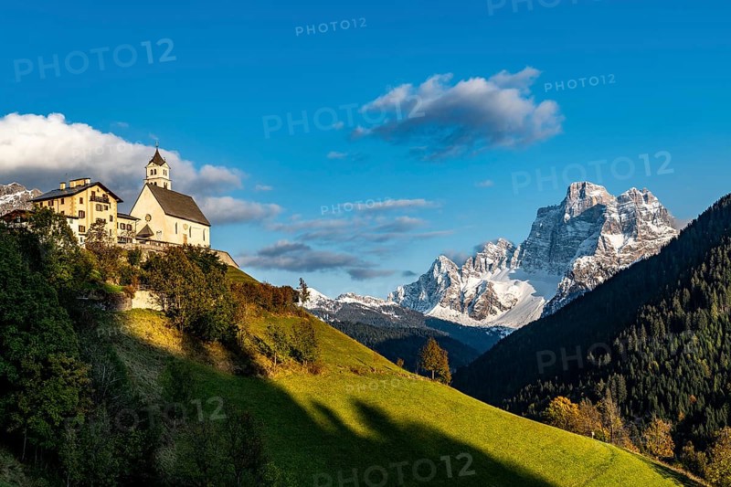 Church of Colle Santa Lucia with peak of Monte Pelmo in the background