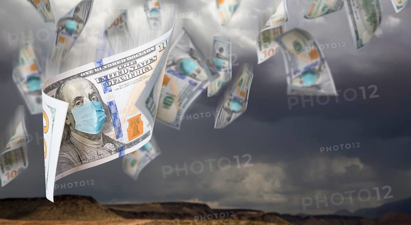 100 dollar bills with face mask falling from stormy cloudy sky