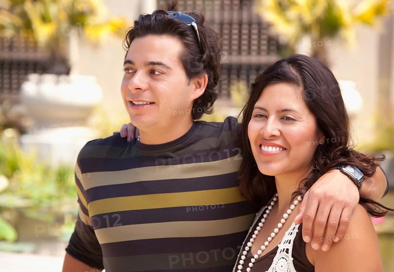 Attractive hispanic couple enjoying themselves at the park