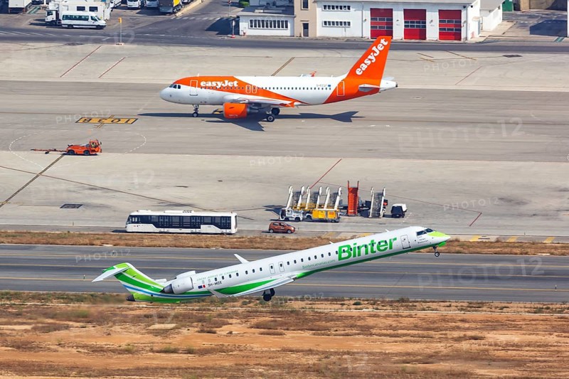 A Bombardier CRJ-1000 aircraft of Binter with registration 9H-MOX takes off from Palma de Majorca Airport
