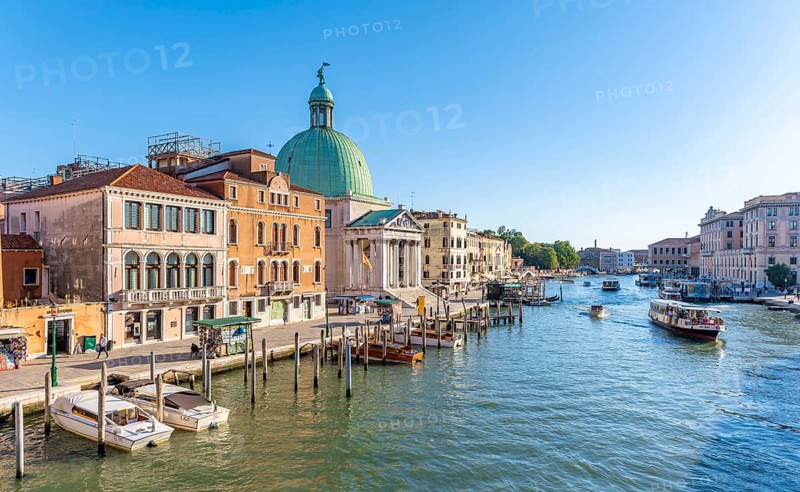 Boats on the Grand Canal with church San Simeone Piccolo at the Ponte degli Scalzi