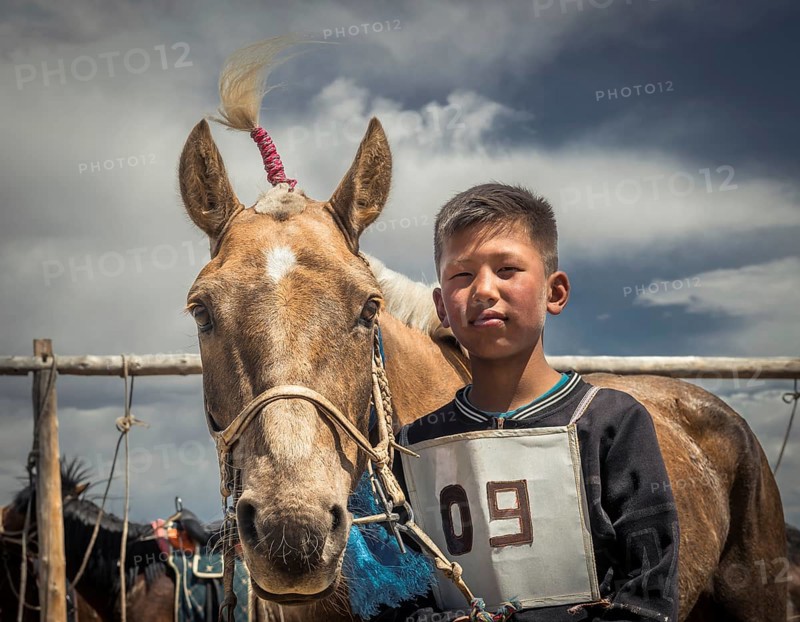Boy at the horse race