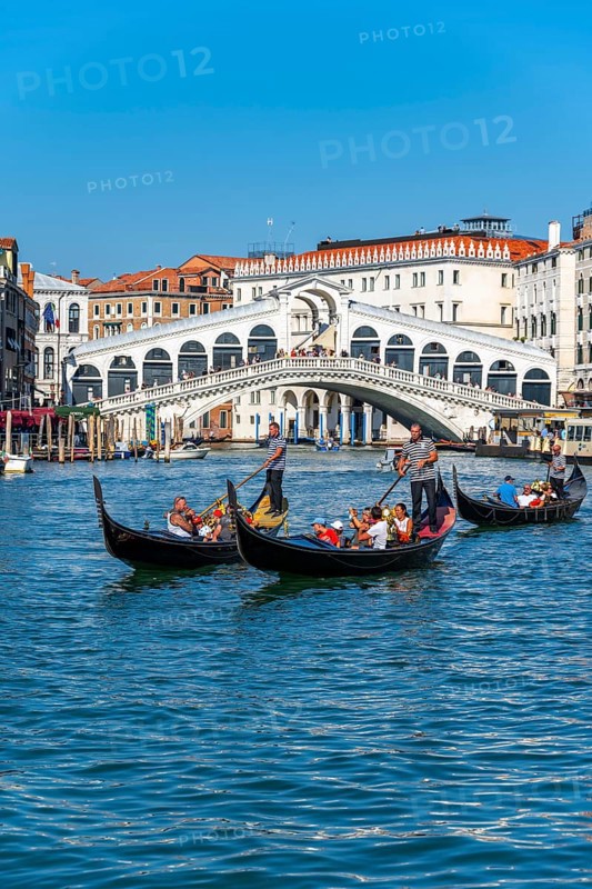 Gondola with tourists on the Grand Canal