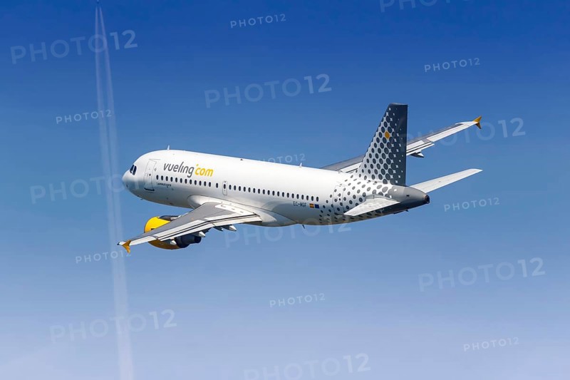 A Vueling Airbus A319 with the registration EC-MGF takes off from Barcelona Airport