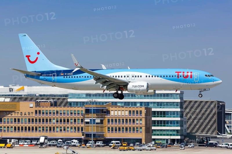 A TUIfly Boeing 737-800 with registration D-ASUN lands at Stuttgart Airport
